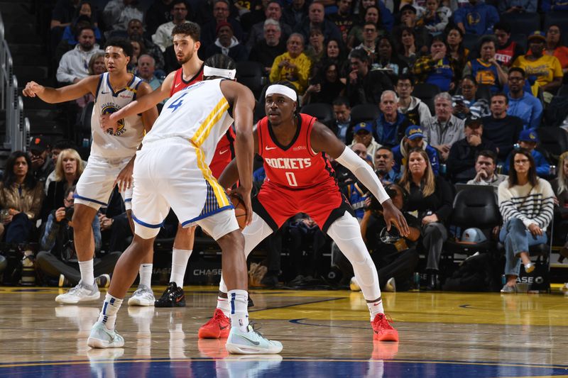 SAN FRANCISCO, CA - DECEMBER 5: Aaron Holiday #0 of the Houston Rockets plays defense during the game against the Golden State Warriors on December 5, 2024 at Chase Center in San Francisco, California. NOTE TO USER: User expressly acknowledges and agrees that, by downloading and or using this photograph, user is consenting to the terms and conditions of Getty Images License Agreement. Mandatory Copyright Notice: Copyright 2024 NBAE (Photo by Noah Graham/NBAE via Getty Images)