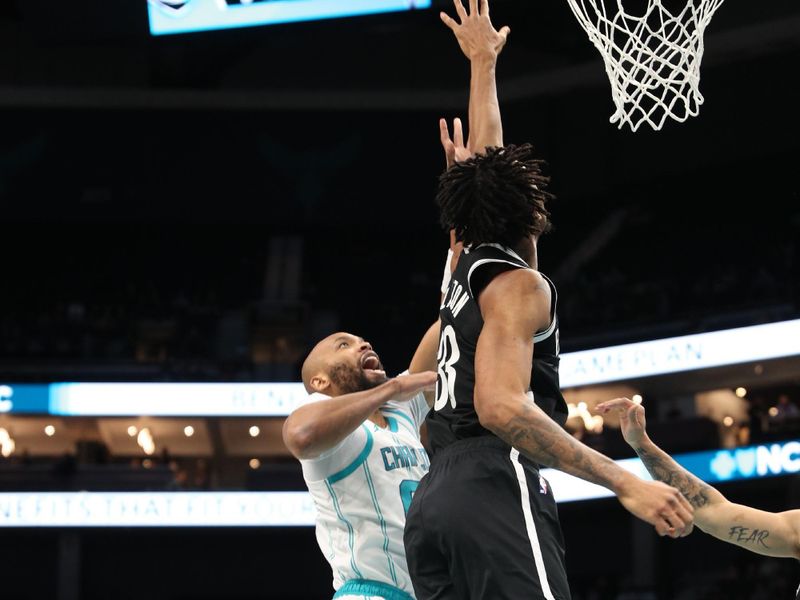 CHARLOTTE, NC - JANUARY 29:  Nicolas Claxton #33 of the Brooklyn Nets plays defense during the game against the Charlotte Hornets on January 29, 2025 at Spectrum Center in Charlotte, North Carolina. NOTE TO USER: User expressly acknowledges and agrees that, by downloading and or using this photograph, User is consenting to the terms and conditions of the Getty Images License Agreement. Mandatory Copyright Notice: Copyright 2025 NBAE (Photo by Brock Williams-Smith/NBAE via Getty Images)