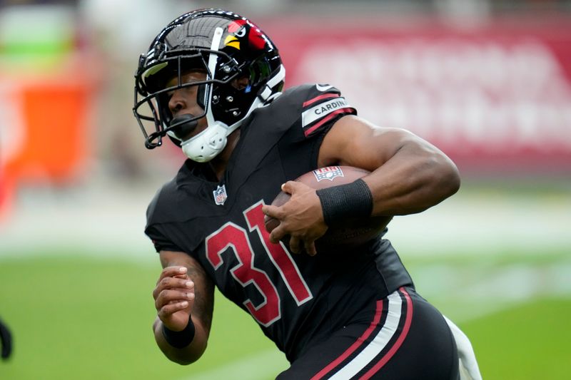 Arizona Cardinals running back Emari Demercado warms up prior to an NFL football game against the Cincinnati Bengals, Sunday, Oct. 8, 2023, in Glendale, Ariz. (AP Photo/Ross D. Franklin)