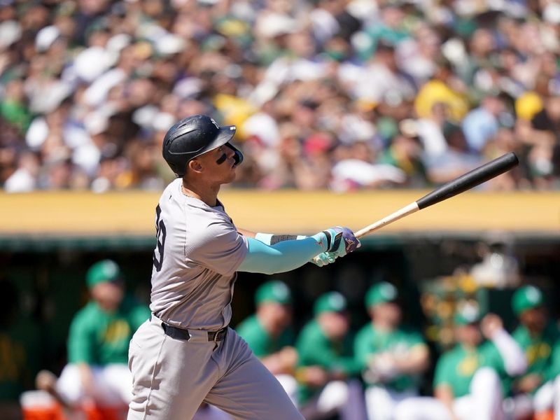 Sep 22, 2024; Oakland, California, USA; New York Yankees center fielder Aaron Judge (99) hits a home run against the Oakland Athletics in the third inning at the Oakland-Alameda County Coliseum. Mandatory Credit: Cary Edmondson-Imagn Images