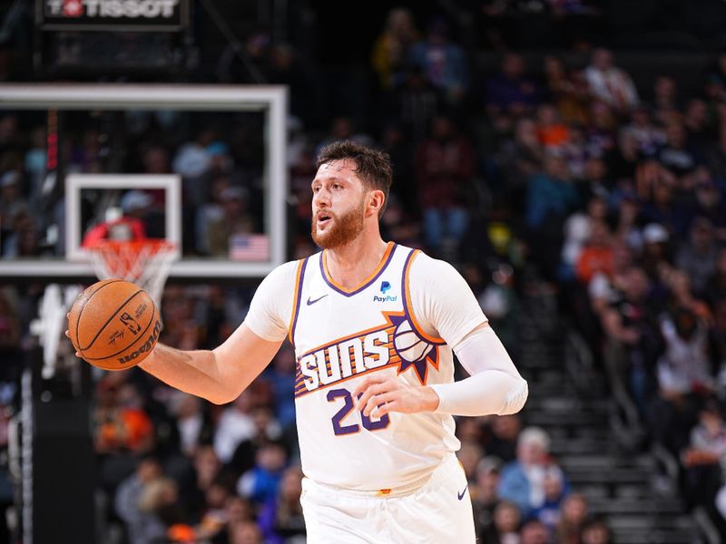 PHOENIX, AZ - JANUARY 22: Jusuf Nurkic #20 of the Phoenix Suns dribbles the ball during the game against the Chicago Bulls on January 22, 2024 at Footprint Center in Phoenix, Arizona. NOTE TO USER: User expressly acknowledges and agrees that, by downloading and or using this photograph, user is consenting to the terms and conditions of the Getty Images License Agreement. Mandatory Copyright Notice: Copyright 2024 NBAE (Photo by Garrett Ellwood/NBAE via Getty Images)