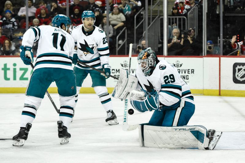 Nov 10, 2024; Newark, New Jersey, USA; San Jose Sharks goaltender Mackenzie Blackwood (29) makes a save against the New Jersey Devils during the second period at Prudential Center. Mandatory Credit: John Jones-Imagn Images