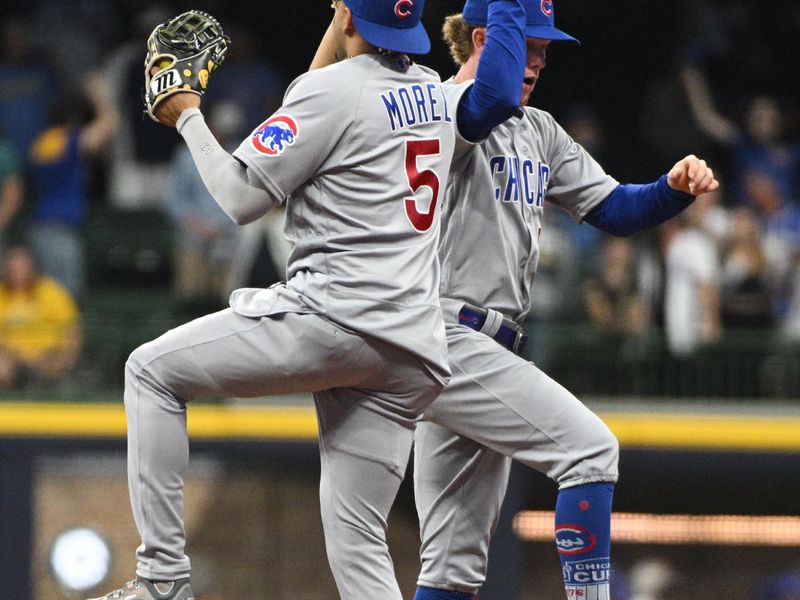 Sep 30, 2023; Milwaukee, Wisconsin, USA; Chicago Cubs second baseman Christopher Morel (5) and Chicago Cubs center fielder Pete Crow-Armstrong (52) celebrate a 10-6 win over the Milwaukee Brewers  at American Family Field. Mandatory Credit: Michael McLoone-USA TODAY Sports