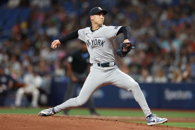 Jul 10, 2024; St. Petersburg, Florida, USA; New York Yankees pitcher Luke Weaver (30) throws a pitch against the Tampa Bay Rays in the seventh inning at Tropicana Field. Mandatory Credit: Nathan Ray Seebeck-USA TODAY Sports