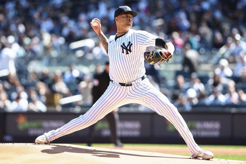 Apr 7, 2024; Bronx, New York, USA;  New York Yankees starting pitcher Luis Gil (81) pitches in the first inning against the Toronto Blue Jays at Yankee Stadium. Mandatory Credit: Wendell Cruz-USA TODAY Sports