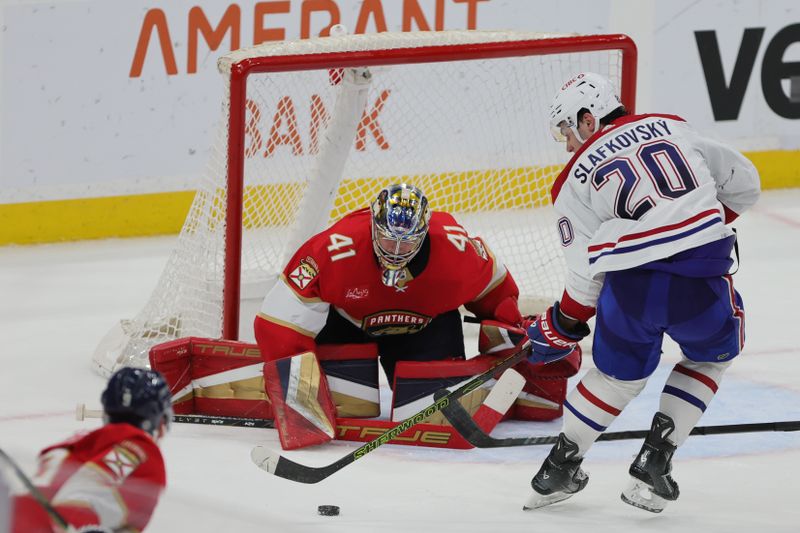 Feb 29, 2024; Sunrise, Florida, USA; Montreal Canadiens left wing Juraj Slafkovsky (20) shoots the puck against Florida Panthers goaltender Anthony Stolarz (41) during overtime at Amerant Bank Arena. Mandatory Credit: Sam Navarro-USA TODAY Sports