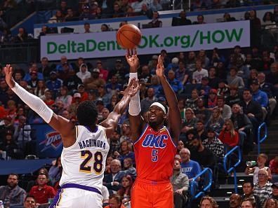 OKLAHOMA CITY, OK - DECEMBER 23: Luguentz Dort #5 of the Oklahoma City Thunder three point basket during the game against the Los Angeles Lakers on December 23, 2023 at Paycom Arena in Oklahoma City, Oklahoma. NOTE TO USER: User expressly acknowledges and agrees that, by downloading and or using this photograph, User is consenting to the terms and conditions of the Getty Images License Agreement. Mandatory Copyright Notice: Copyright 2023 NBAE (Photo by Zach Beeker/NBAE via Getty Images)