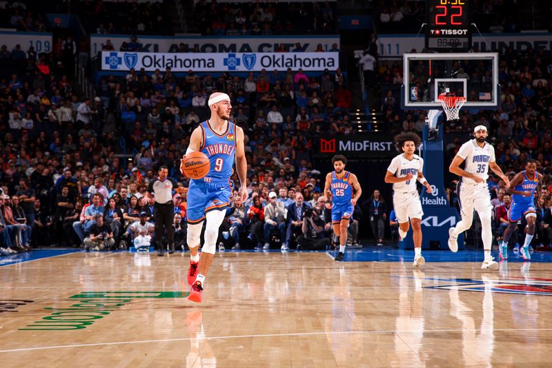 OKLAHOMA CITY, OK - NOVEMBER 4:  Alex Caruso #9 of the Oklahoma City Thunder dribbles the ball during the game against the Orlando Magic on November 4, 2024 at Paycom Center in Oklahoma City, Oklahoma. NOTE TO USER: User expressly acknowledges and agrees that, by downloading and or using this photograph, User is consenting to the terms and conditions of the Getty Images License Agreement. Mandatory Copyright Notice: Copyright 2024 NBAE (Photo by Zach Beeker/NBAE via Getty Images)