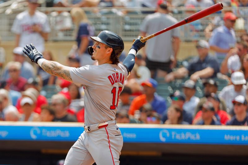 Jul 30, 2025; Minneapolis, Minnesota, USA; Boston Red Sox center fielder Jarren Duran (16) hits a two run home run against the Minnesota Twins in the sixth inning at Target Field. Mandatory Credit: Bruce Kluckhohn-Imagn Images