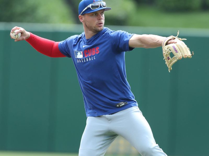 May 1, 2025; Pittsburgh, Pennsylvania, USA; Chicago Cubs second baseman Nico Hoerner (2) warms up before the game against the Pittsburgh Pirates at PNC Park. Mandatory Credit: Charles LeClaire-Imagn Images