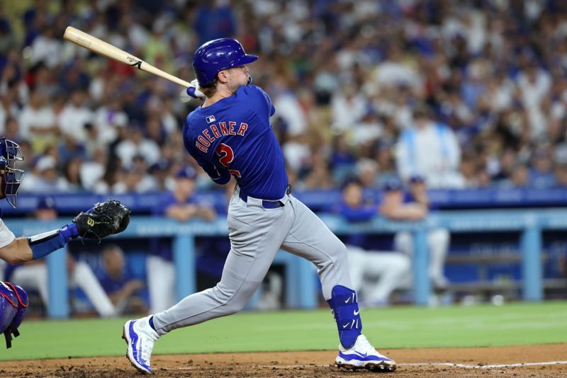 Sep 10, 2024; Los Angeles, California, USA;  Chicago Cubs second baseman Nico Hoerner (2) hits a single during the seventh inning against the Los Angeles Dodgers at Dodger Stadium. Mandatory Credit: Kiyoshi Mio-Imagn Images