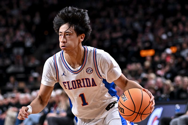 Feb 7, 2026; College Station, Texas, USA; Florida Gators guard Xaivian Lee (1) controls the ball during the first half against the Texas A&M Aggies at Reed Arena. Mandatory Credit: Maria Lysaker-Imagn Images 