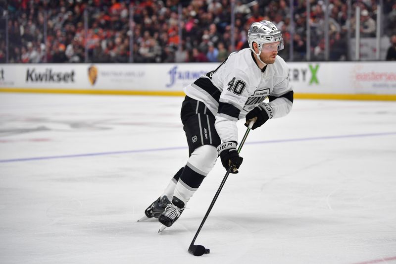 Nov 28, 2025; Anaheim, California, USA; Los Angeles Kings right wing Joel Armia (40) moves the puck against the Anaheim Ducks during the third period at Honda Center. Mandatory Credit: Gary A. Vasquez-Imagn Images