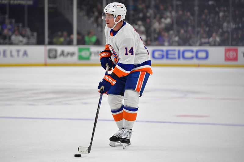 Mar 11, 2024; Los Angeles, California, USA; New York Islanders center Bo Horvat (14) controls the puck against the Los Angeles Kings during the first period at Crypto.com Arena. Mandatory Credit: Gary A. Vasquez-USA TODAY Sports