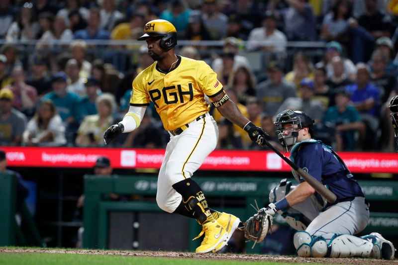 Aug 16, 2024; Pittsburgh, Pennsylvania, USA;  Pittsburgh Pirates designated hitter Andrew McCutchen (22) hits a single against the Seattle Mariners during the seventh inning at PNC Park. Mandatory Credit: Charles LeClaire-USA TODAY Sports