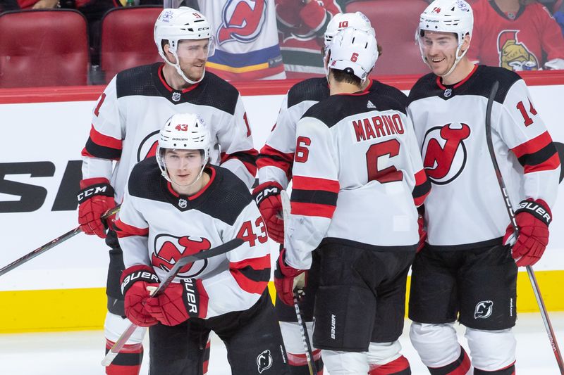 Dec 29, 2023; Ottawa, Ontario, CAN; New Jersey Devils defenseman Luke Hughes (43) skates to the bench following his goal scored in the third period against the Ottawa Senators at the Canadian Tire Centre. Mandatory Credit: Marc DesRosiers-USA TODAY Sports