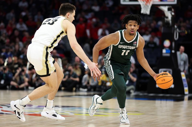 Mar 15, 2024; Minneapolis, MN, USA; Michigan State Spartans guard A.J. Hoggard (11) works around Purdue Boilermakers forward Camden Heide (23) during the second half at Target Center. Mandatory Credit: Matt Krohn-USA TODAY Sports