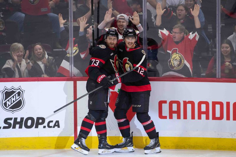 Oct 19, 2024; Ottawa, Ontario, CAN; Ottawa Senators left wing Noah Gregor (73) celebrates with center Shane Pinto (12) his goal scored in the third period against the Tampa Bay Lightning  at the Canadian Tire Centre. Mandatory Credit: Marc DesRosiers-Imagn Images