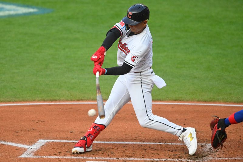 Aug 14, 2024; Cleveland, Ohio, USA; Cleveland Guardians second baseman Andres Gimenez (0) singles in the second inning against the Chicago Cubs at Progressive Field. Mandatory Credit: David Richard-USA TODAY Sports