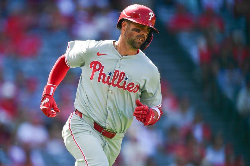 May 1, 2024; Anaheim, California, USA; Philadelphia Phillies second baseman Whit Merrifield (9) runs after hitting a double against the Los Angeles Angels during the ninth inning at Angel Stadium. Mandatory Credit: Gary A. Vasquez-USA TODAY Sports