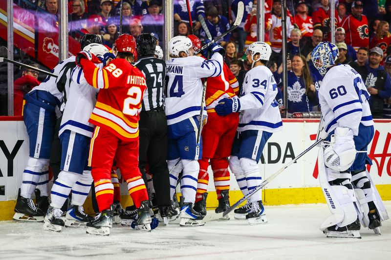 Feb 2, 2026; Calgary, Alberta, CAN; Calgary Flames and Toronto Maple Leafs players get into a scrum during the second period at Scotiabank Saddledome. Mandatory Credit: Sergei Belski-Imagn Images