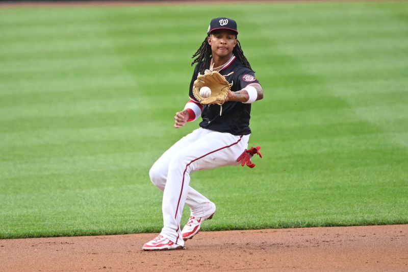 Jun 5, 2025; Washington, District of Columbia, USA; Washington Nationals shortstop CJ Abrams (5) fields a ground ball during the first inning against the Chicago Cubs at Nationals Park. Mandatory Credit: Rafael Suanes-Imagn Images