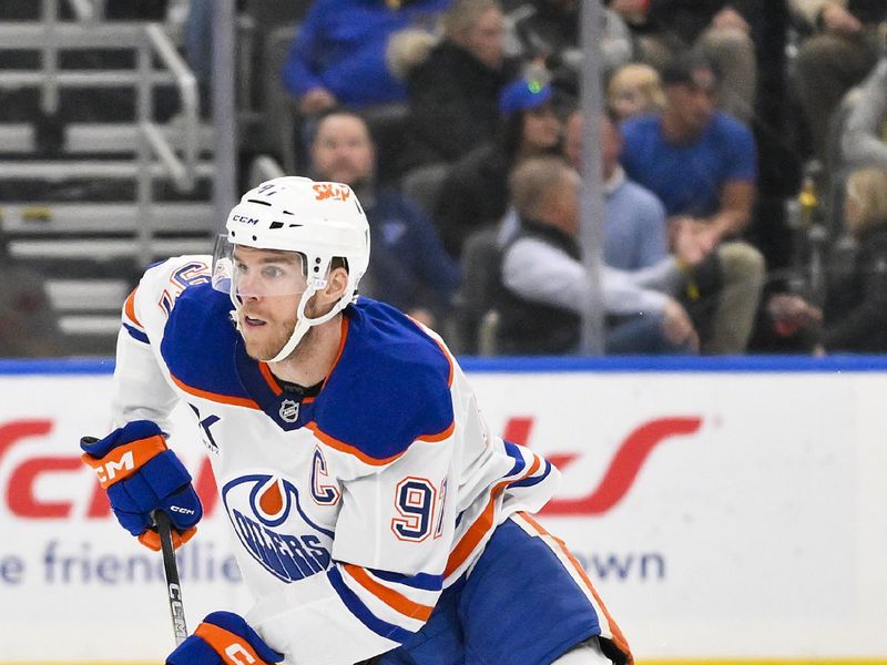 Nov 3, 2025; St. Louis, Missouri, USA; Edmonton Oilers center Connor McDavid (97) controls the puck against the St. Louis Blues during the first period at Enterprise Center. Mandatory Credit: Jeff Curry-Imagn Images