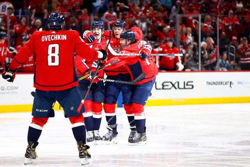 Mar 24, 2024; Washington, District of Columbia, USA; Washington Capitals defenseman John Carlson (74) celebrates with teammates after scoring a goal against the Winnipeg Jets during the third period at Capital One Arena. Mandatory Credit: Amber Searls-USA TODAY Sports