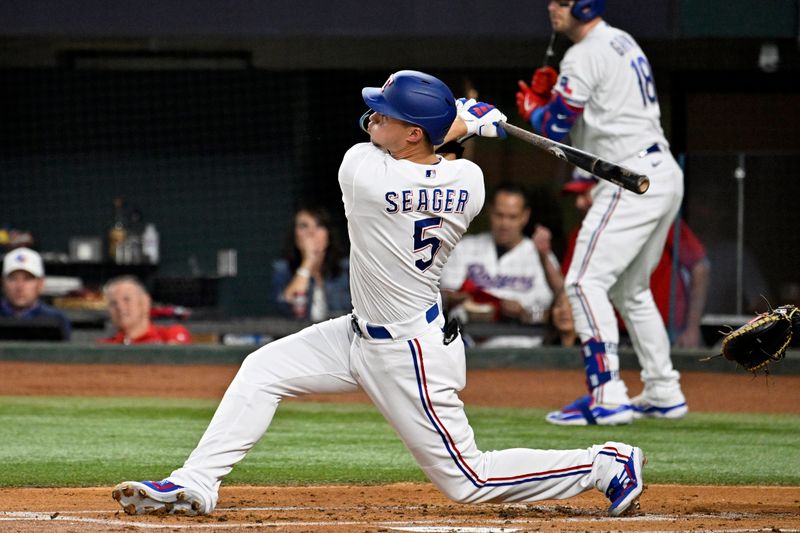 Oct 10, 2023; Arlington, Texas, USA; Texas Rangers shortstop Corey Seager (5) hits a solo home run against the Baltimore Orioles in the first inning during game three of the ALDS for the 2023 MLB playoffs at Globe Life Field. Mandatory Credit: Jerome Miron-USA TODAY Sports