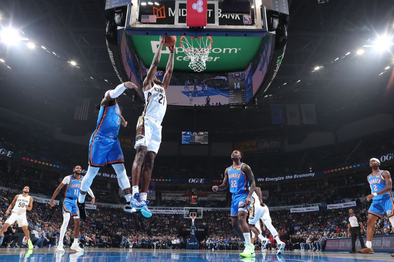 OKLAHOMA CITY, OK - NOVEMBER 13: Yves Missi #21 of the New Orleans Pelicans dunks the ball during the game against the Oklahoma City Thunder on November 13, 2024 at Paycom Center in Oklahoma City, Oklahoma. NOTE TO USER: User expressly acknowledges and agrees that, by downloading and or using this photograph, User is consenting to the terms and conditions of the Getty Images License Agreement. Mandatory Copyright Notice: Copyright 2024 NBAE (Photo by Nathaniel S. Butler/NBAE via Getty Images)