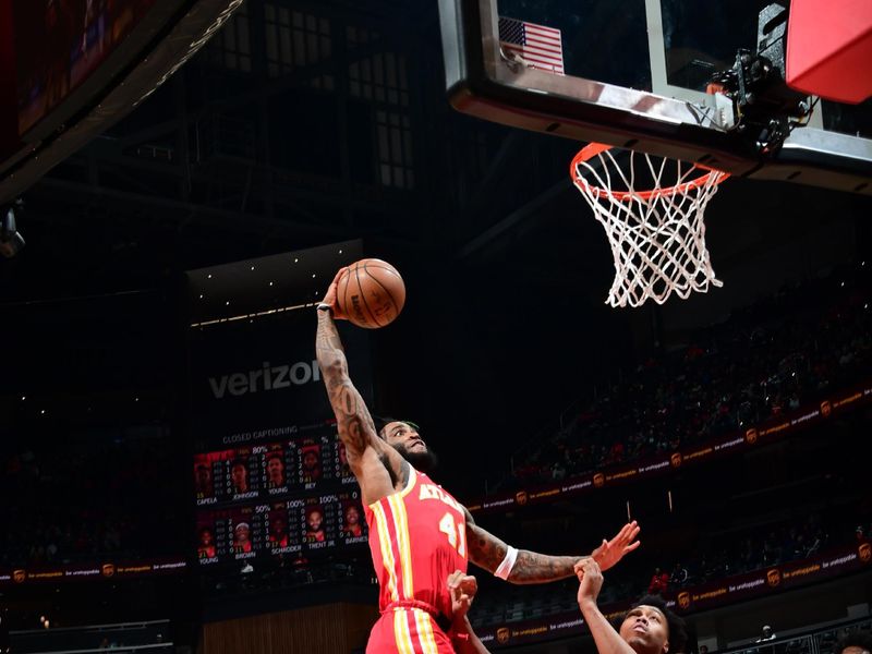 ATLANTA, GA - JANUARY 28: Saddiq Bey #41 of the Atlanta Hawks dunks the ball during the game against the Toronto Raptors on January 28, 2024 at State Farm Arena in Atlanta, Georgia.  NOTE TO USER: User expressly acknowledges and agrees that, by downloading and/or using this Photograph, user is consenting to the terms and conditions of the Getty Images License Agreement. Mandatory Copyright Notice: Copyright 2024 NBAE (Photo by Scott Cunningham/NBAE via Getty Images)