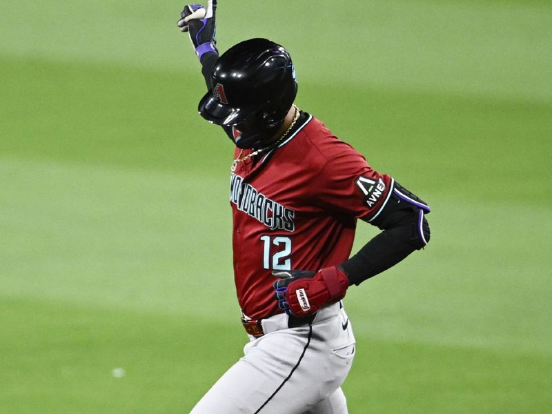 Jun 6, 2024; San Diego, California, USA; Arizona Diamondbacks left fielder Lourdes Gurriel Jr. (12) celebrates after hitting a solo home run during the seventh inning against the San Diego Padres at Petco Park. Mandatory Credit: Denis Poroy-USA TODAY Sports at Petco Park. 