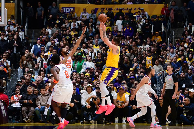 LOS ANGELES, CA - MARCH 6: Luka Doncic #77 of the Los Angeles Lakers shoots the ball during the game against the New York Knicks  on March 6, 2025 at Crypto.Com Arena in Los Angeles, California. NOTE TO USER: User expressly acknowledges and agrees that, by downloading and/or using this Photograph, user is consenting to the terms and conditions of the Getty Images License Agreement. Mandatory Copyright Notice: Copyright 2025 NBAE (Photo by Adam Pantozzi/NBAE via Getty Images)