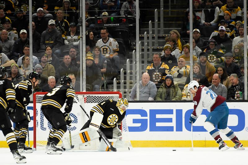 Jan 18, 2024; Boston, Massachusetts, USA; Colorado Avalanche left wing Miles Wood (28) shoots and scores a goal past Boston Bruins goaltender Jeremy Swayman (1) during the first period at TD Garden. Mandatory Credit: Bob DeChiara-USA TODAY Sports