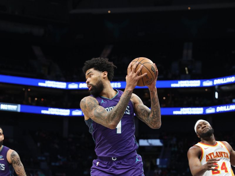 CHARLOTTE, NC - FEBRUARY 14: Nick Richards #4 of the Charlotte Hornets rebounds the ball during the game against the Atlanta Hawks on February 14, 2024 at Spectrum Center in Charlotte, North Carolina. NOTE TO USER: User expressly acknowledges and agrees that, by downloading and or using this photograph, User is consenting to the terms and conditions of the Getty Images License Agreement.  Mandatory Copyright Notice:  Copyright 2024 NBAE (Photo by Brock Williams-Smith/NBAE via Getty Images)