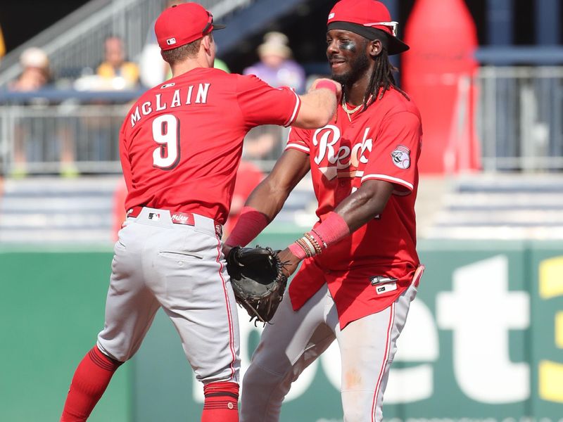 Aug 10, 2025; Pittsburgh, Pennsylvania, USA;  Cincinnati Reds second baseman Matt McLain (9) and shortstop Elly De La Cruz (44) celebrate after defeating the Pittsburgh Pirates at PNC Park. Mandatory Credit: Charles LeClaire-Imagn Images