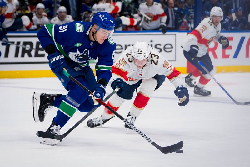 Dec 14, 2023; Vancouver, British Columbia, CAN; Vancouver Canucks defenseman Nikita Zadorov (91) drives past Florida Panthers forward Carter Verhaeghe (23) in the second period at Rogers Arena. Mandatory Credit: Bob Frid-USA TODAY Sports.