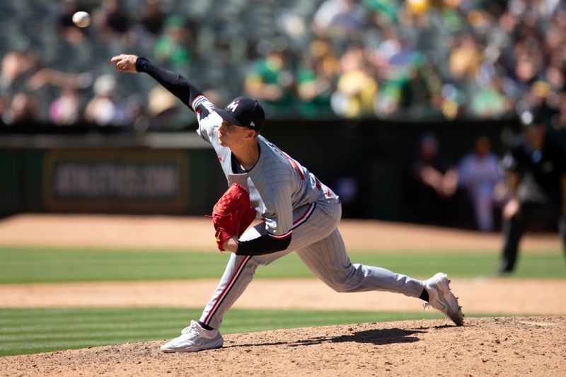 Jun 23, 2024; Oakland, California, USA; Minnesota Twins pitcher Griffin Jax (22) delivers a pitch against the Oakland Athletics during the ninth inning at Oakland-Alameda County Coliseum. Mandatory Credit: D. Ross Cameron-USA TODAY Sports