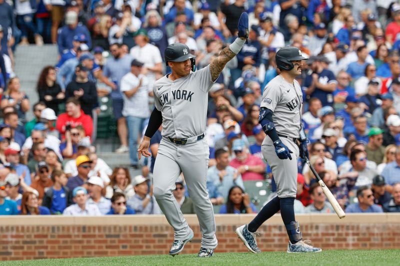 Sep 6, 2024; Chicago, Illinois, USA; New York Yankees second baseman Gleyber Torres (25) celebrates after scoring against the Chicago Cubs during the third inning at Wrigley Field. Mandatory Credit: Kamil Krzaczynski-Imagn Images