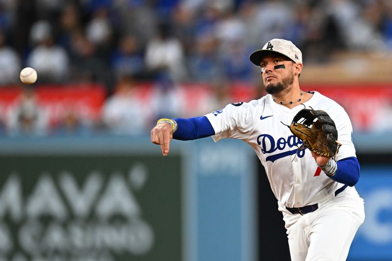 May 17, 2025; Los Angeles, California, USA; Los Angeles Dodgers second baseman Miguel Rojas (72) fields a ball against the Los Angeles Angels during the fifth inning at Dodger Stadium. Mandatory Credit: Jonathan Hui-Imagn Images