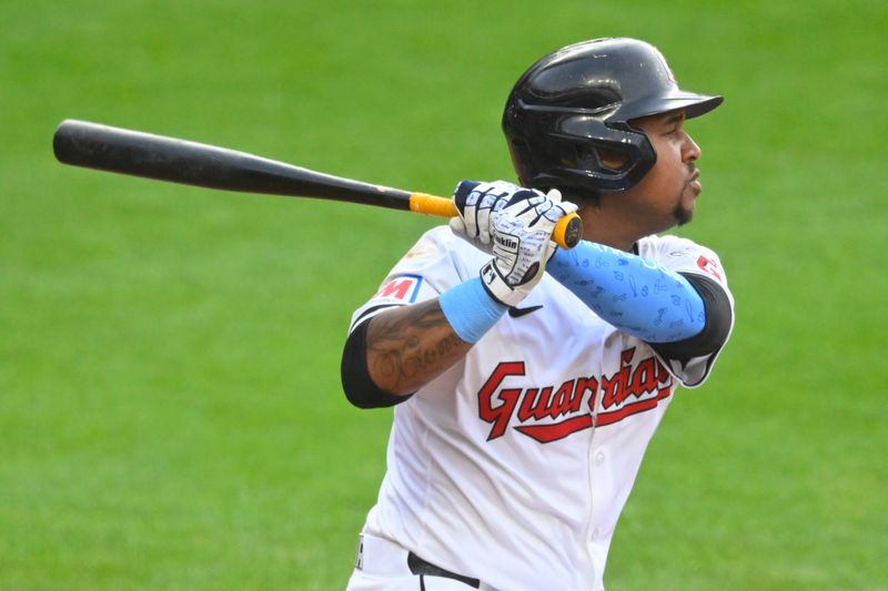 May 7, 2024; Cleveland, Ohio, USA; Cleveland Guardians third baseman Jose Ramirez (11) hits a two-RBI single in the second inning against the Detroit Tigers at Progressive Field. Mandatory Credit: David Richard-USA TODAY Sports