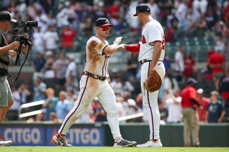 Jul 7, 2024; Atlanta, Georgia, USA; Atlanta Braves center fielder Jarred Kelenic (24) and first baseman Matt Olson (28) celebrate after a victory against the Philadelphia Phillies at Truist Park. Mandatory Credit: Brett Davis-USA TODAY Sports
