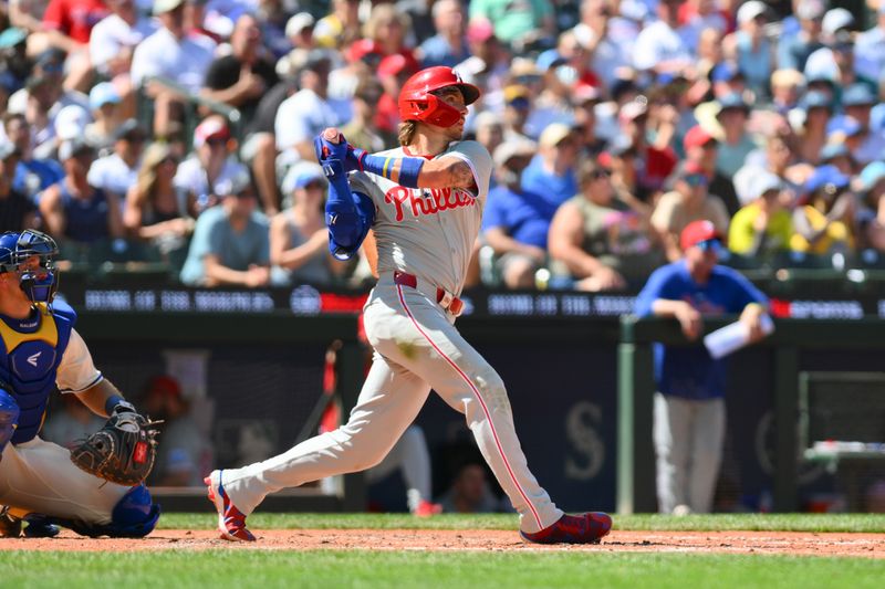 Aug 4, 2024; Seattle, Washington, USA; Philadelphia Phillies second baseman Bryson Stott (5) hits a home run against the Seattle Mariners during the eighth inning at T-Mobile Park. Mandatory Credit: Steven Bisig-USA TODAY Sports