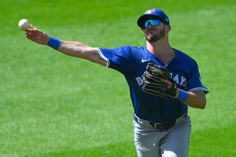 Jun 23, 2024; Cleveland, Ohio, USA; Toronto Blue Jays second baseman Spencer Horwitz (48) throws to first base in the fifth inning against the Cleveland Guardians at Progressive Field. Mandatory Credit: David Richard-USA TODAY Sports