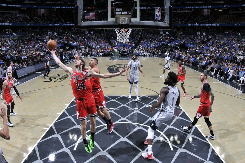 ORLANDO, FL - NOVEMBER 27: Matas Buzelis #14 of Chicago Bulls rebounds the ball during the game against the Orlando Magic on November 27, 2024 at Kia Center in Orlando, Florida. NOTE TO USER: User expressly acknowledges and agrees that, by downloading and or using this photograph, User is consenting to the terms and conditions of the Getty Images License Agreement. Mandatory Copyright Notice: Copyright 2024 NBAE (Photo by Fernando Medina/NBAE via Getty Images)