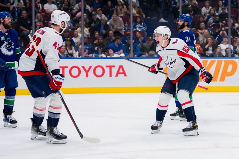 Mar 16, 2024; Vancouver, British Columbia, CAN; Washington Capitals forward Tom Wilson (43) and forward Ivan Miroshnichenko (63) celebrate Wilson’s goal against the Vancouver Canucks in the second period at Rogers Arena. Mandatory Credit: Bob Frid-USA TODAY Sports