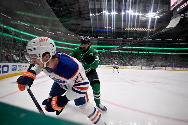 May 29, 2025; Dallas, Texas, USA; Dallas Stars defenseman Lian Bichsel (6) checks Edmonton Oilers center Trent Frederic (21) into the boards in game five of the Western Conference Final of the 2025 Stanley Cup Playoffs at American Airlines Center. Mandatory Credit: Jerome Miron-Imagn Images