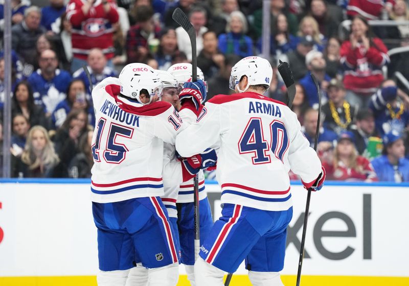 Nov 9, 2024; Toronto, Ontario, CAN; Montreal Canadiens right wing Brendan Gallagher (11) scores a goal and celebrates with center Alex Newhook (15) against the Toronto Maple Leafs during the second period at Scotiabank Arena. Mandatory Credit: Nick Turchiaro-Imagn Images