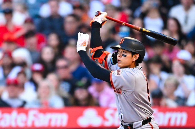 Apr 19, 2025; Anaheim, California, USA; San Francisco Giants outfielder Jung Hoo Lee (51) forced out at first base against the San Francisco Giants during the first inning at Angel Stadium. Mandatory Credit: Jonathan Hui-Imagn Images