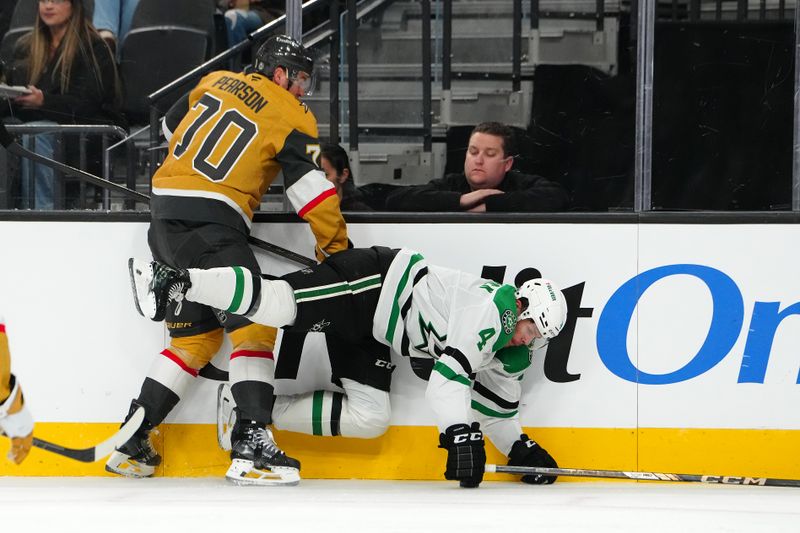 Dec 6, 2024; Las Vegas, Nevada, USA; Vegas Golden Knights left wing Tanner Pearson (70) checks Dallas Stars defenseman Miro Heiskanen (4) during the second period at T-Mobile Arena. Mandatory Credit: Stephen R. Sylvanie-Imagn Images